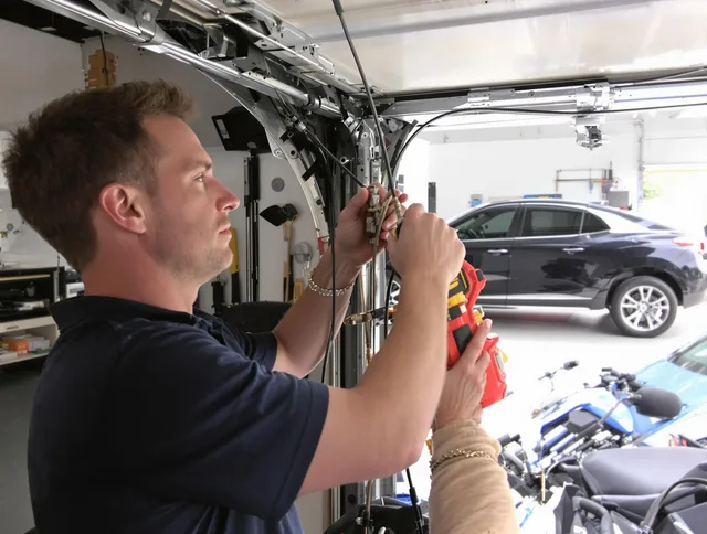 Perris Garage Door Repair safety certified technician performing cable replacement in Perris