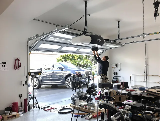 Perris Garage Door Repair specialist installing smart garage door opener system in Perris home