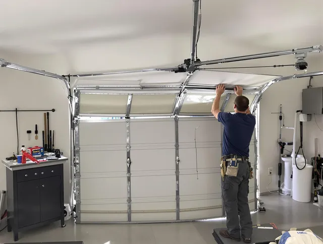 Perris Garage Door Repair specialist performing precise section replacement on Perris garage door